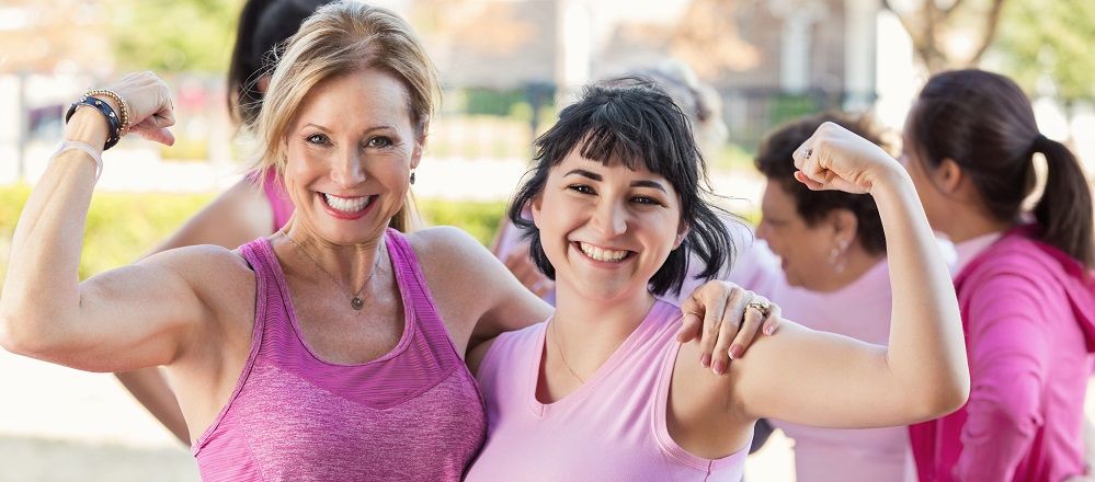 women flexing their muscles