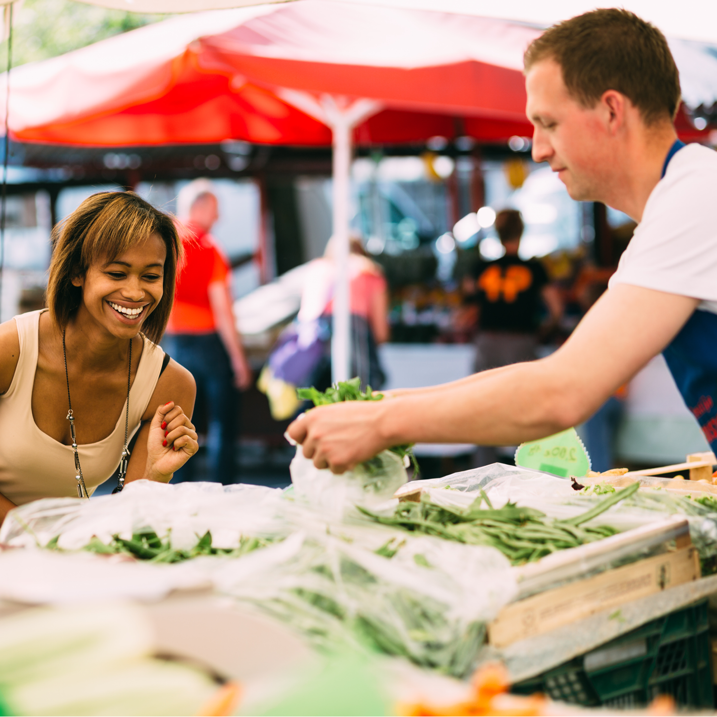 a woman shopping at a farmer's market