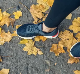 running shoes in fall leaves