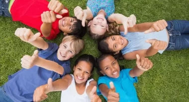 children giving a thumbs up