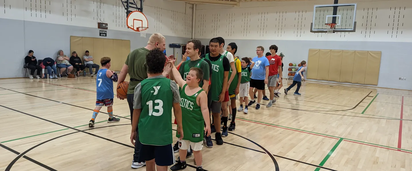 adaptive basketball teams shaking hands after game
