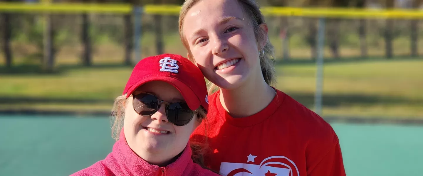 ymca adaptive baseball participant and volunteer