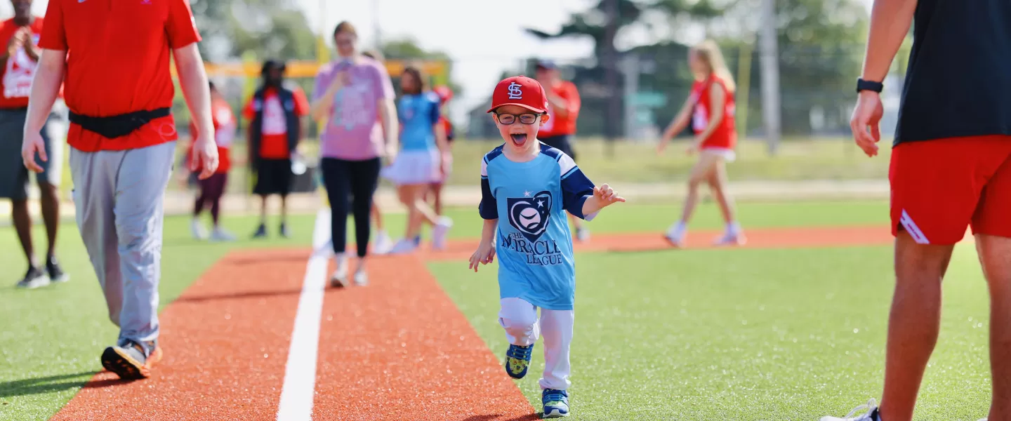 child running bases at ymca adaptive sports complex opening day