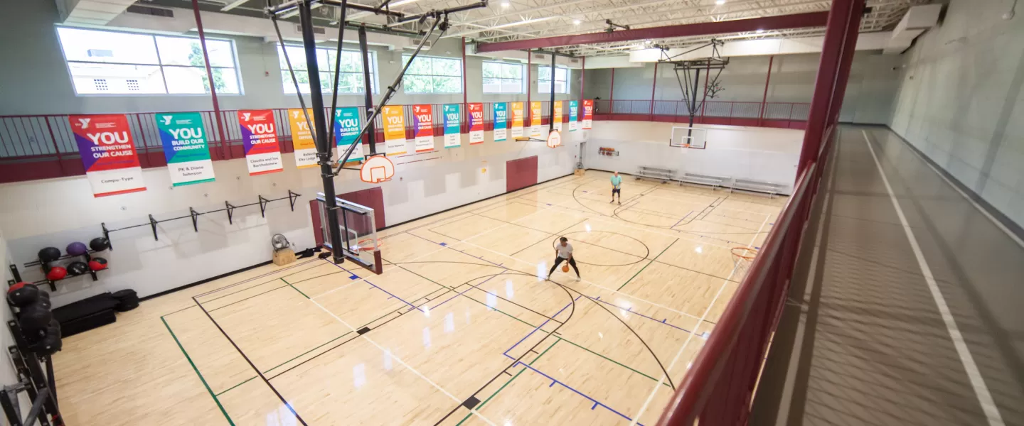 The basketball gymnasium at the Downtown Belleville YMCA houses a full court as well as 2 smaller courts for youth basketball games.