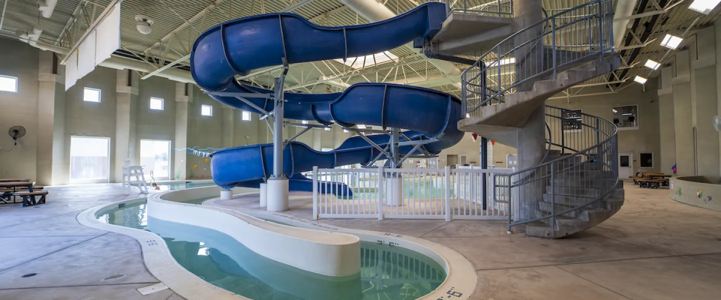 Ste. Genevieve County YMCA Indoor Pool and Aquatic Center featuring a Lazy River and Two Story Water Slide