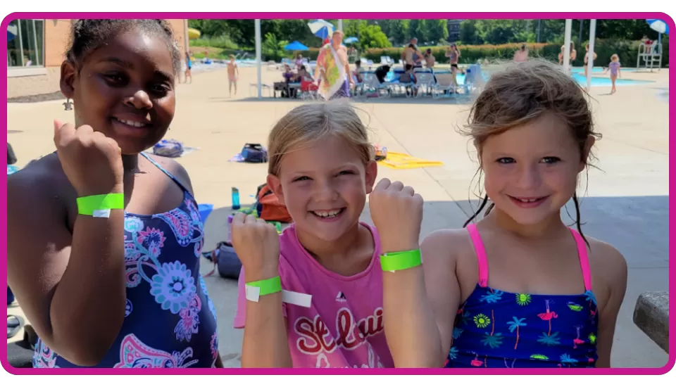 young girls at YMCA smiling after passing their swim test