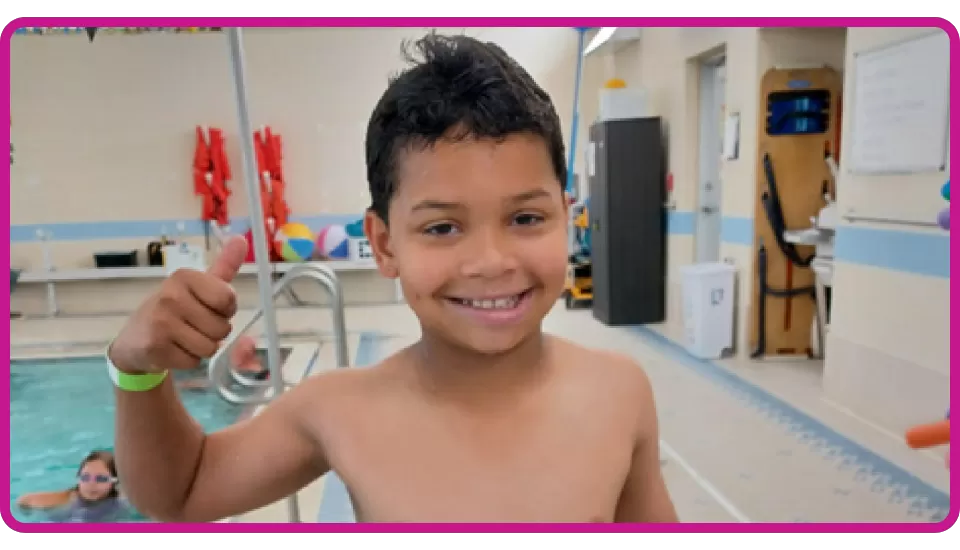 young boy at YMCA who passed his swim test