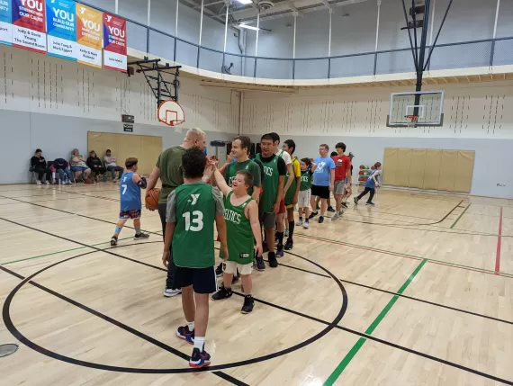 adaptive basketball teams shaking hands after game