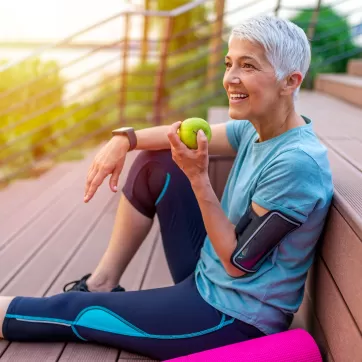 older woman eating healthy and exercising