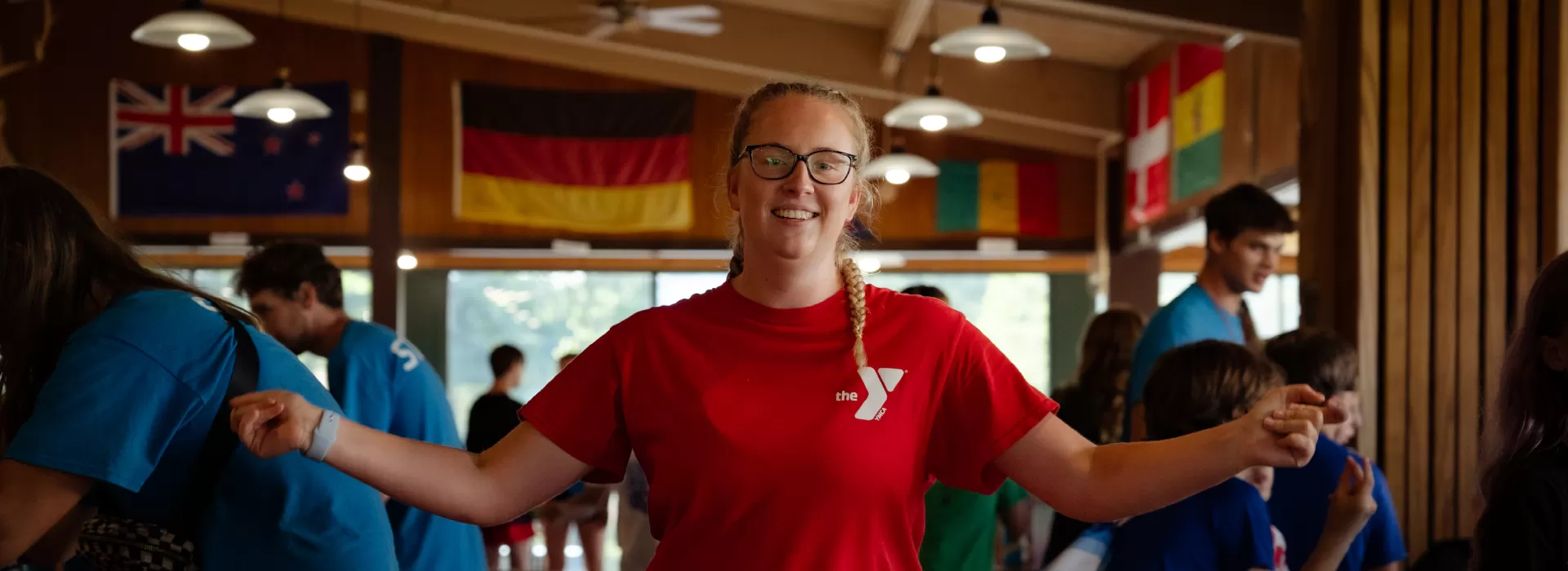 Female counselor in red staff shirt