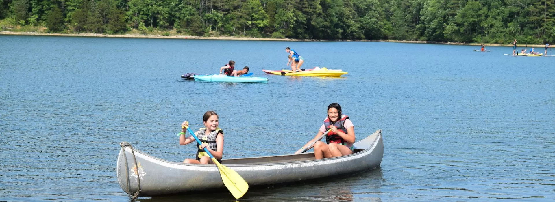 ymca camp lakewood girls in canoe on sunnen lake