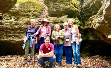 women posing for photo outdoors at women's wellness weekend in ymca trout lodge